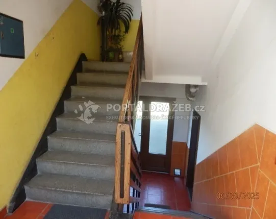 Spoluvlastnický podíl ve výši 1/2 na rodinném domu v obci Pavlíkov, okres Rakovník